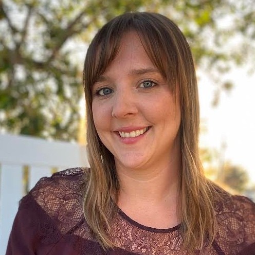 headshot of michelle chikos wearing a blue blazer