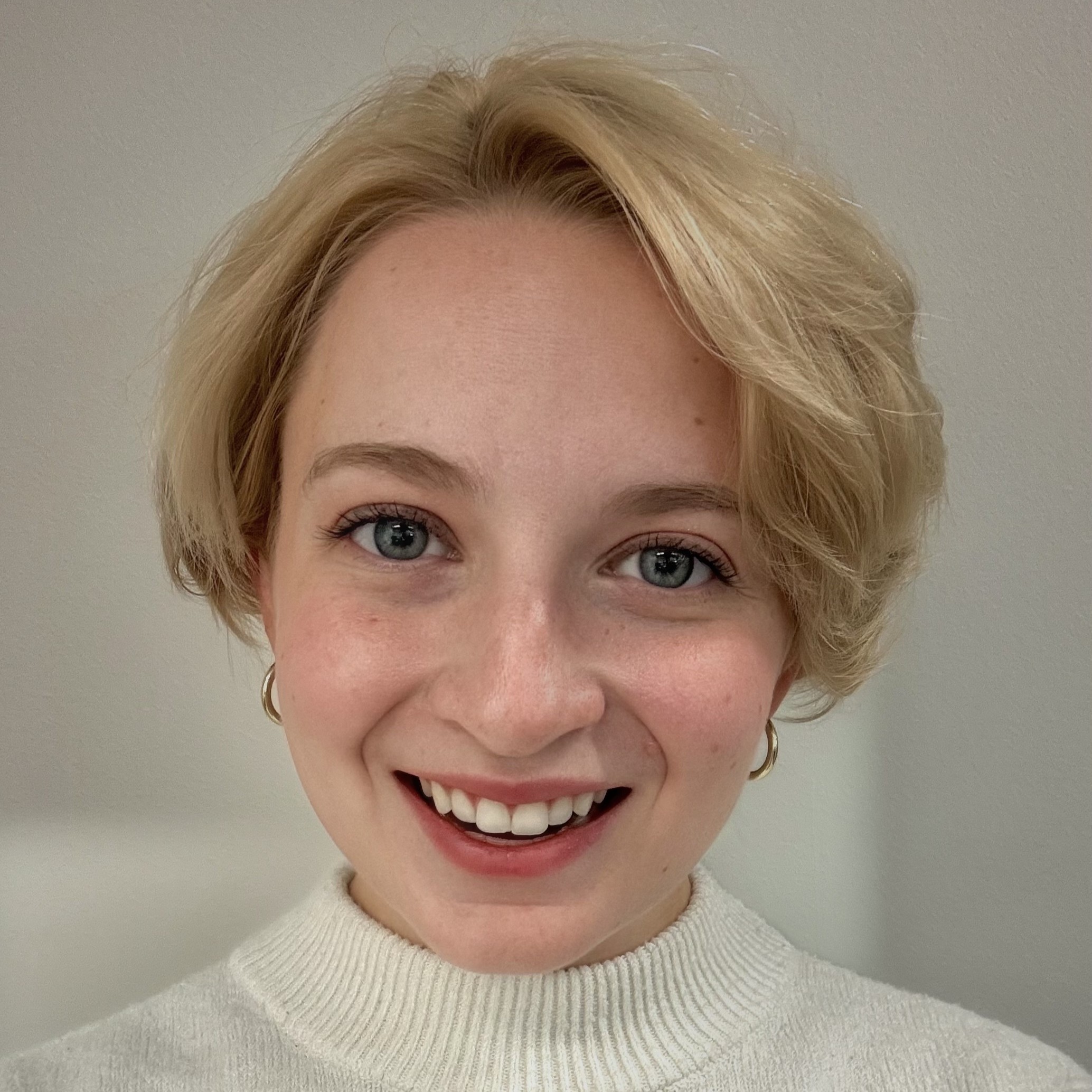 headshot of bailey ellis wearing blue suit
