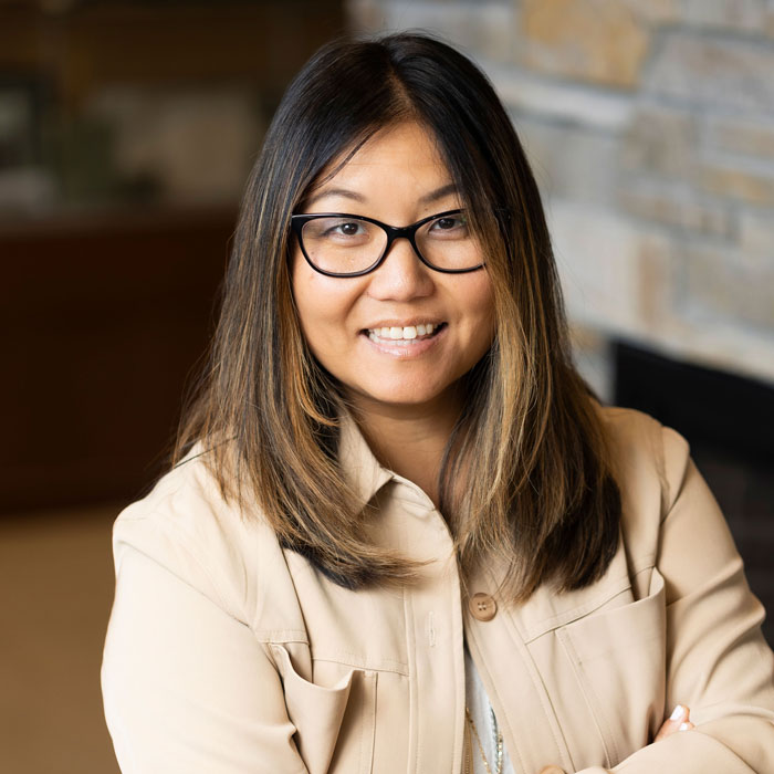 headshot of jo dwyer wearing tan blazer