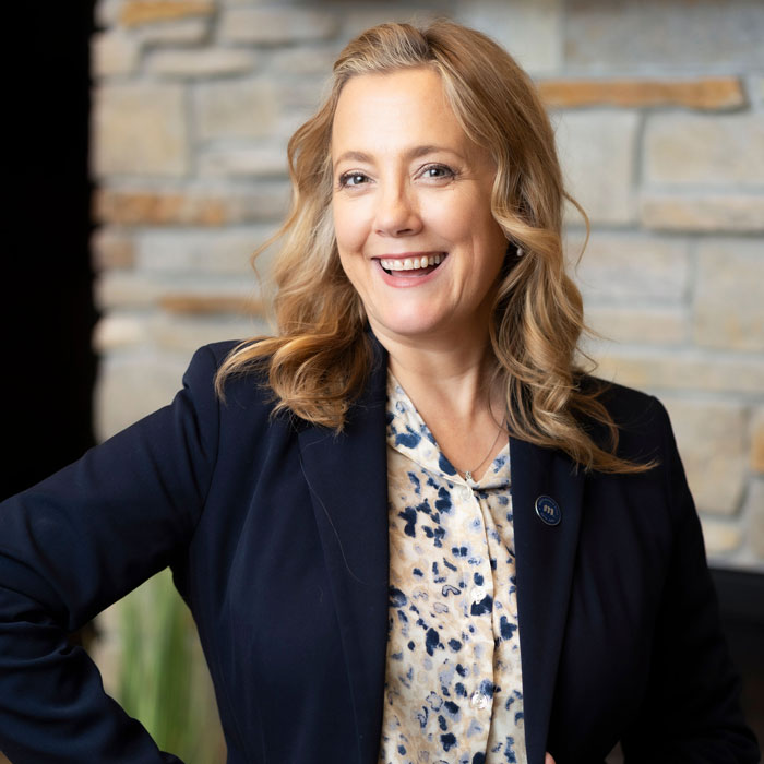 headshot of brad johnson wearing blue suit and tie